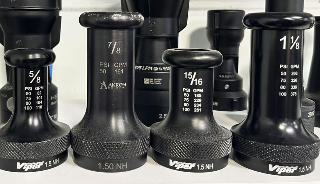 Machined smooth-bore nozzles used as calibration references.