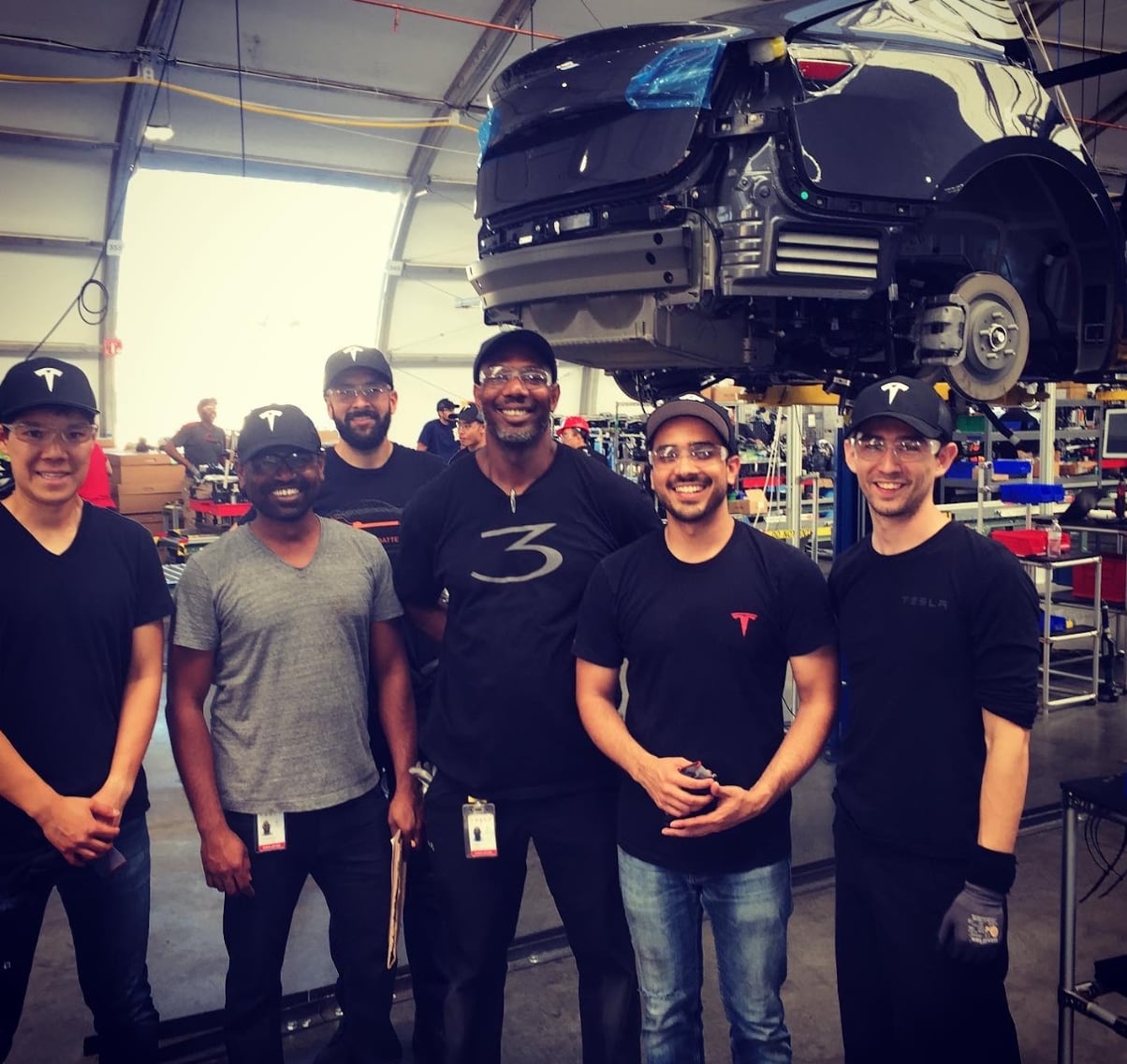 Standing with amazing individuals who worked tirelessly to build and ship cars